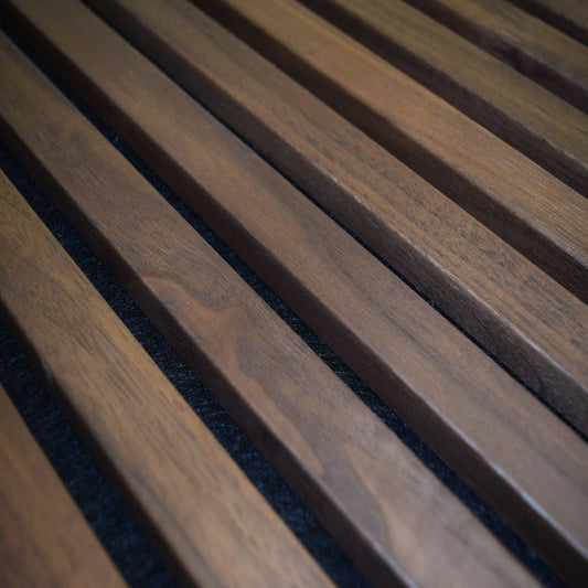 Close-up of wooden slats with a dark background walnut acoustic wood panel slat wood panel